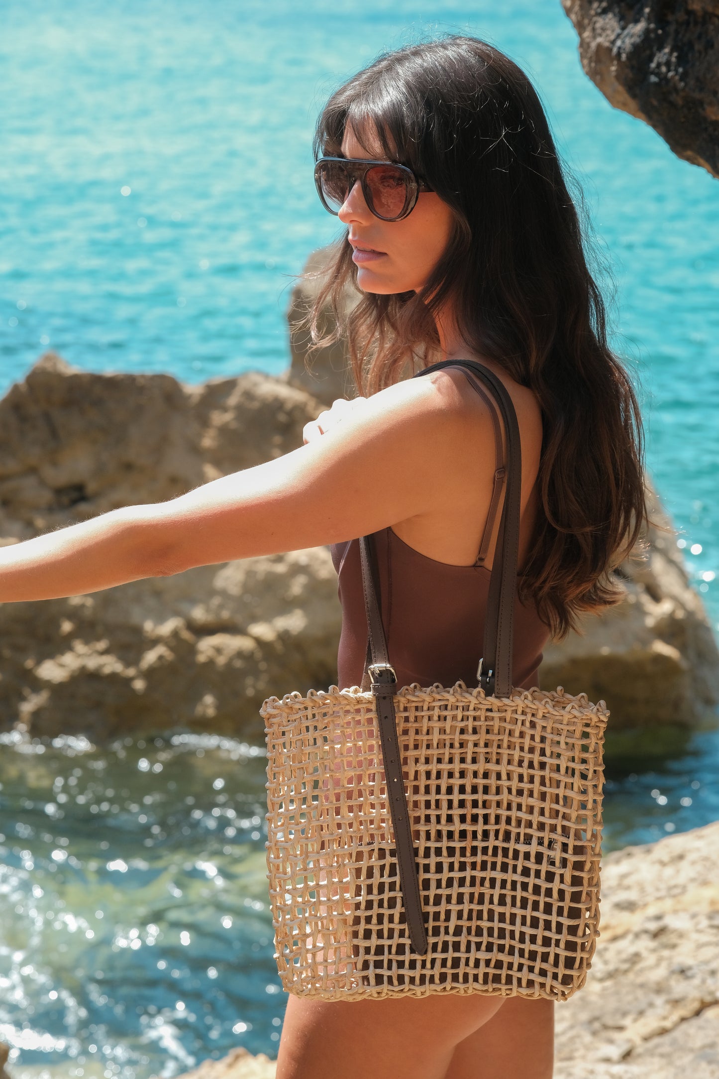 Woven raffia tote bag with leather pouch