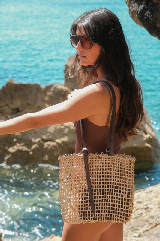 Woven raffia tote bag with leather pouch